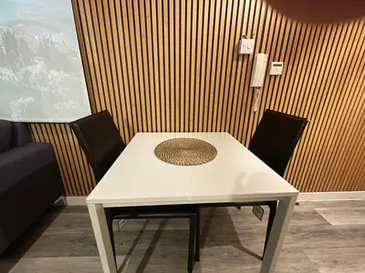 a white table with two chairs in a room at Radio City Apartments City Centre sleeps 4 in Liverpool