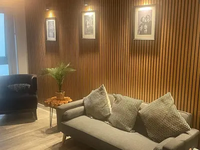 a living room with a couch and a chair at Manhattan Apartment City Centre sleeps 4 in Liverpool