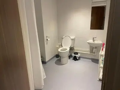 a bathroom with a toilet and a sink at Manhattan Apartment City Centre sleeps 4 in Liverpool