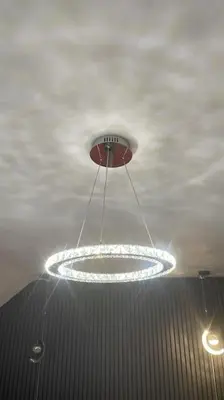 a circular light hanging from the ceiling of a building at 30 The Elms in Blackpool
