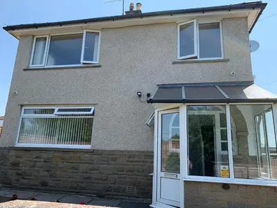 a house with a window and a door at Hamilton Hideaway between Lancaster & Morecambe in Bare