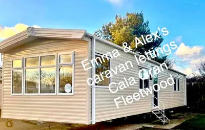 a small house with a sign on the side of it at Caravan-Blackpool-FamilyFriendly-Activities in Fleetwood