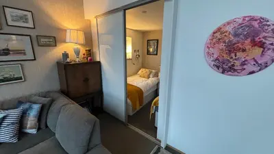 a room with a bedroom with a bed and a mirror at Float uniquely on Liverpool Waterfront on our high end 8 berth Houseboat in Liverpool