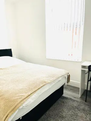 a bedroom with a bed and a window and a desk at Walton Breck Road, Anfield LFC in Liverpool