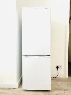 a white refrigerator in a room next to a wall at Walton Breck Road, Anfield LFC in Liverpool