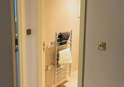 a bathroom with a towel rack in a room at Heritage Bank Liverpool Near Cavern sleeps 3 in Liverpool