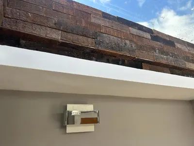 a brick wall on the side of a building at Entire Seaside Home 6 Private BedRooms Sleeps 10,4 Minute Walk To Station in New Brighton