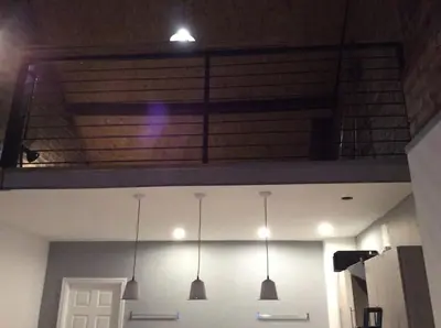 a room with three lights hanging from the ceiling at 2 bedroom apartment in Horwich
