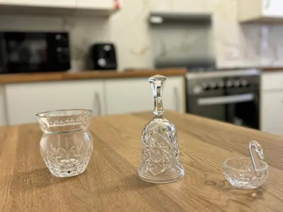 a glass bottle and a glass bowl on a table at ENTIRE LUXURY HOUSE near CITY CENTRE - FREE PARKING in Liverpool