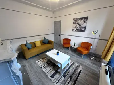 a living room with a couch and a table at Modern Retreat Your Birkenhead Heaven, A Peaceful Getaway in Birkenhead
