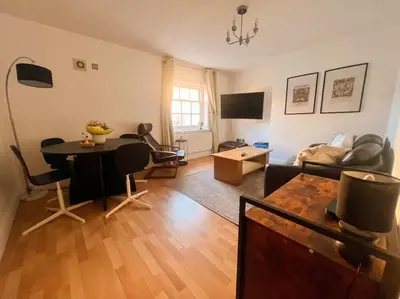 a living room with a table and a couch at Cosy 2bed City Centre Flat! in Liverpool
