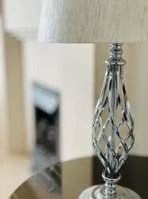 a clear glass lamp sitting on a table at Luxe Residences - Preston in Preston