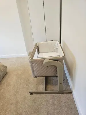 a wicker chair sitting in a corner of a room at Luxe Residences - Preston in Preston
