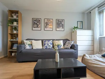 a living room with a couch and a table at City Centre Vintage Theme Guest Rooms in Liverpool