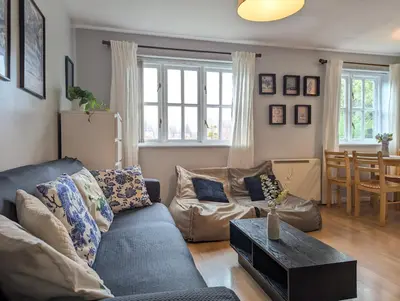 a living room with a couch and a table at City Centre Vintage Theme Guest Rooms in Liverpool