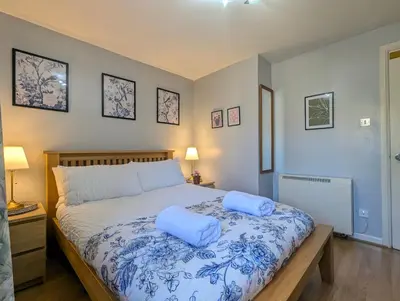 a bedroom with a bed with two pillows on it at City Centre Vintage Theme Guest Rooms in Liverpool