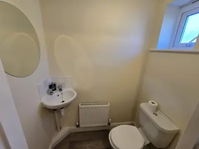 a small bathroom with a toilet and a sink at A Classic Home in Liverpool in Liverpool