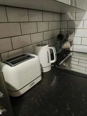 a toaster sitting on a counter in a kitchen at The Old Bike Cabin Flat 1 in Heapey
