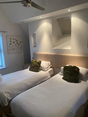 two beds sitting next to each other in a room at The Rooms Lytham in Lytham St Annes
