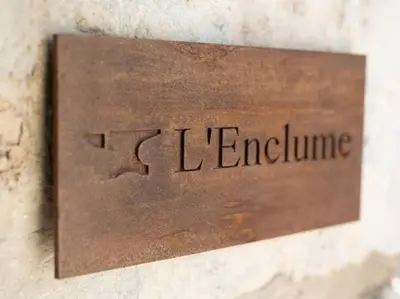 a sign that says le mentime on a wall at 2 Bed Cottage in Peaceful South Lakes Village in Cark