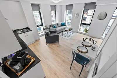 an overhead view of a living room with a table and chairs at Baltic Triangle Apartment in Liverpool