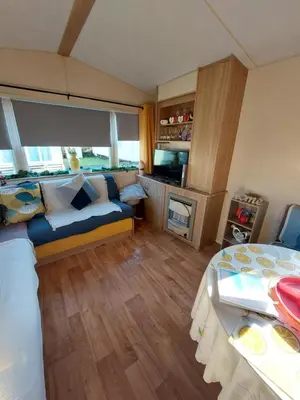 a bedroom with a bed and a couch in a room at Mags den in Morecambe