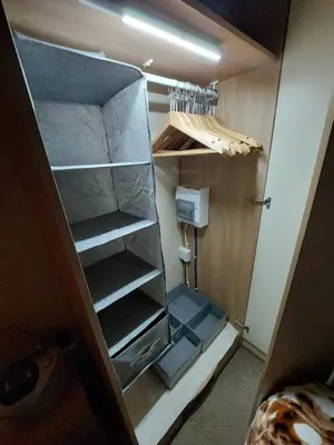 an empty closet with shelves in a room at Mags den in Morecambe