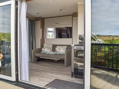 a view of a living room from the balcony of a house at The Lodge Pod in Barrow in Furness