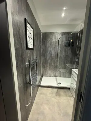 a bathroom with a shower and a bath tub at 38 Everton Road Free onsite parking in Liverpool