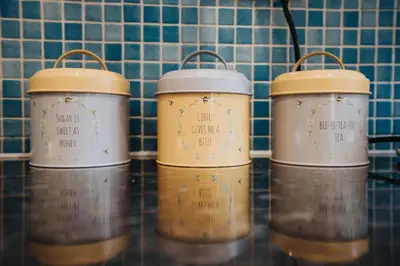 a group of three jars sitting on top of a counter at VICHY - Temple Court Superb apartment in City Center in Liverpool