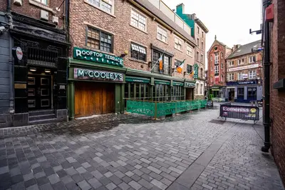 an empty street in a city with buildings at VICHY - Temple Court Superb apartment in City Center in Liverpool