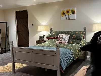 a bedroom with a bed with a bed frame at Luxury Country Lodge in Bretherton - Sleeps 4 in Bretherton