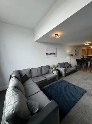 a living room with a couch and a table at Subway Apartments in Blackpool