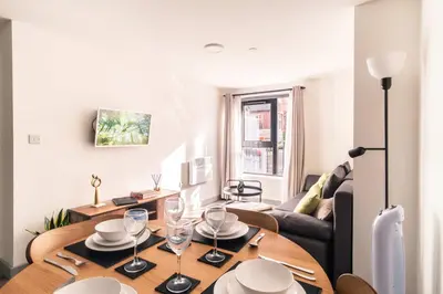 a living room with a table and a couch at Fabulous 1 Bed Apartment in Liverpool Centre in Liverpool