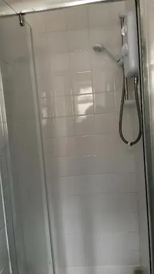 a shower in a bathroom with a glass door at Great House 5 Min walk 2 Beach best locations in Blackpool in Blackpool