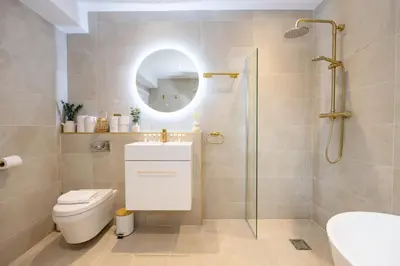 a bathroom with a sink toilet and a mirror at GuestReady - Georgian Quarter retreat with terrace in Liverpool