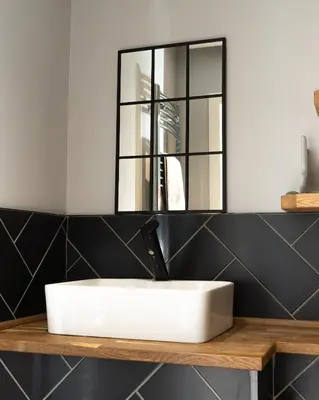 a bathroom with a white sink and a mirror at Charles Alexander Short Stay - Vibe Apartments in Blackpool