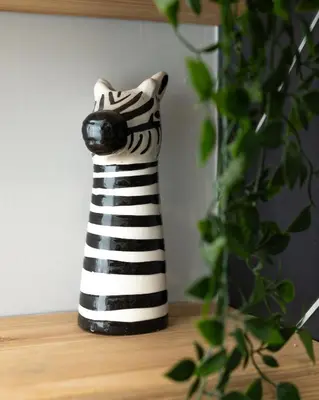 a black and white zebra vase sitting on a table at Charles Alexander Short Stay - Vibe Apartments in Blackpool