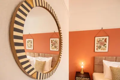 a mirror in a hotel room with a bed at Britannia Apartments in Liscard Village Wallasey by Rework Accommodation in Wallasey