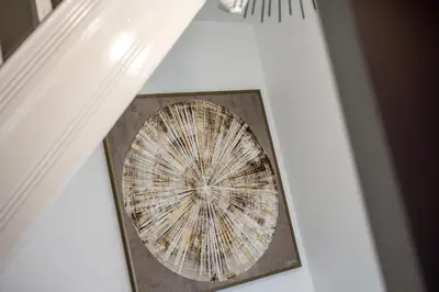 a picture of a dandelion on a ceiling at Anfield Cosy Stays - Air Host & Stay - Sleeps 14 in Liverpool