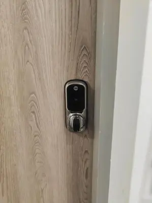 a door with a cell phone sticking out of it at Chelsea 2 bedroom promenade apartment in Blackpool