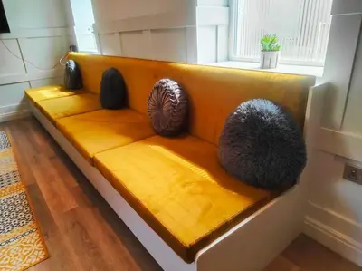a bench with three balls sitting on top of it at Chelsea 2 bedroom promenade apartment in Blackpool