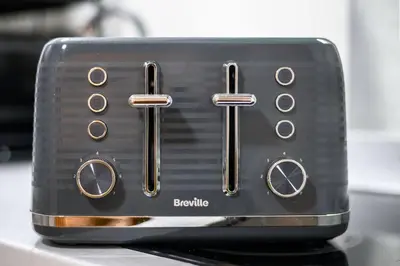 a black toaster sitting on top of a counter at Charming Apartment in Liverpool City Centre - Peaceful Sleep! in Liverpool