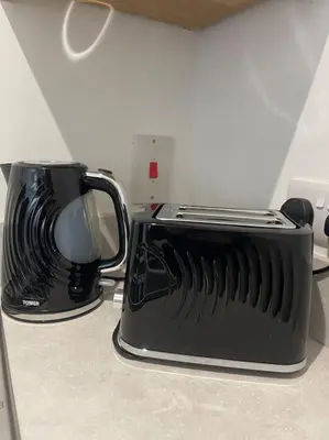 a black toaster oven sitting on top of a counter at Balmoral Stays 6 - Studio Apartment by Pleasure Beach in Blackpool