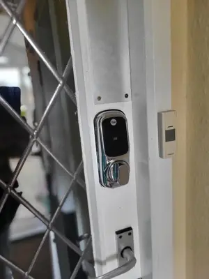 a metal door with a cell phone in it at Station Guesthouse - Self entry via keypad inc parking in Lancaster