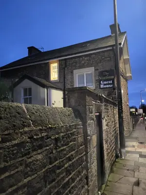 an old stone building with a brick wall at Station Guesthouse - Self entry via keypad inc parking in Lancaster