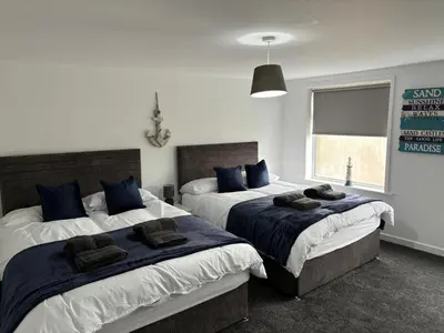 a bedroom with two beds and a window at Apartment Twenty4 Blackpool in Blackpool