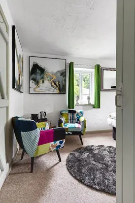 a living room with two chairs and a couch at heft view at rose cottage - opp heft restaurant in Grange Over Sands
