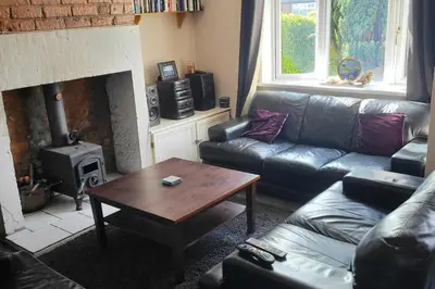 a living room with a couch and a coffee table at Cottage - Sleeps 4 - Garden - Parking in Chorley