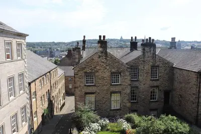 an aerial view of an old brick building at 3 double bed whole house by castle in Lancaster